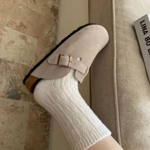 Detailed view of the women's wool cable knit mid-tube socks showing vintage texture and cozy fit.