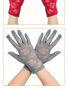 Detailed view of women's short lace sun protection gloves, featuring delicate floral patterns.