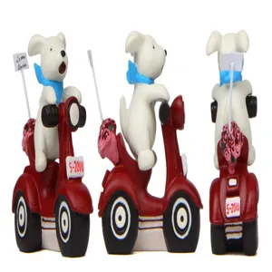 Detailed view of cute cartoon puppy riding red scooter figurine with bouquet and flag decor.
