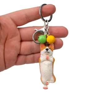 Schicker Yoga Corgi Design Schlüsselanhänger mit bunten Glöckchen und Metallverschluss.