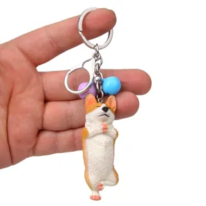 Niedlicher Yoga Corgi Hund Schlüsselanhänger mit farbigen Glocken als stilvoller Taschenanhänger.