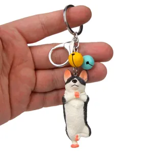 Niedlicher Yoga-Hund Schlüsselanhänger mit bunten Glocken und Metallkarabiner für Taschen.