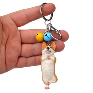 Niedlicher Yoga Corgi Schlüsselanhänger mit bunten Glocken, ideale Taschendeko für Paare.