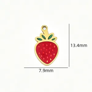 Detailed closeup view of the red strawberry enamel pendant with gold rim, size 13.4x7.9mm.
