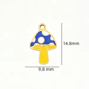 Close-up detail view of colorful enamel mushroom alloy charm pendant for DIY jewelry crafting.