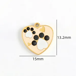 Detail view of gold heart pet paw print pendant, titanium steel DIY jewelry accessory.
