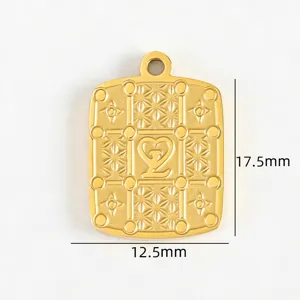 Detailed view of 18k gold tone titanium steel DIY pendant featuring intricate grid floral patterns.