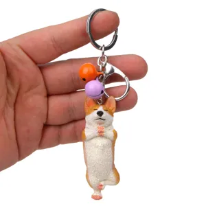 Süßer Corgi Yoga Meditation Schlüsselanhänger mit bunten Glocken und stabilem Metallring.