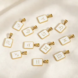 Close-up detail of 12 zodiac gold pendants, stainless steel enamel charms for DIY jewelry making.