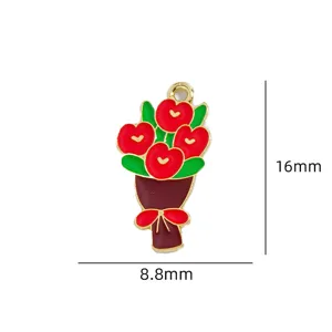 Close-up of a delicate red flower bouquet enamel charm pendant with green leaves and red bow.