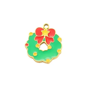 Closeup of Christmas wreath metal pendant, enameled holiday jewelry accessory for DIY bracelet necklace.