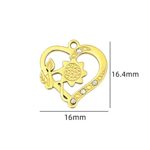 Detail view of ancient gold heart flower pendant with sparkling rhinestones and clear size marks.