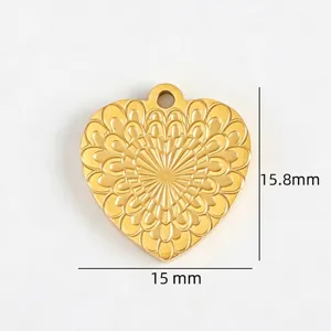 Heart pendant detail shot, gold tone stainless steel DIY jewelry charm with floral pattern.