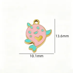 Detailed view of cute pink and mint green enamel narwhal pendant charm, stainless steel.