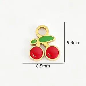 Gold cherry pendant detail, red and green enamel titanium steel DIY jewelry accessory.