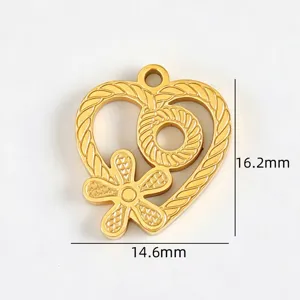 Close-up detail of heart-shaped gold titanium steel pendant with floral texture and dimensions.