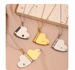 Detailed shot of stainless steel heart locket necklaces in silver and gold, open love letter design.