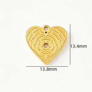 Detailed view of gold stainless steel heart pendant with geometric maze engraving texture.