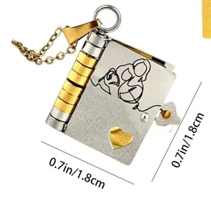 Close-up detail of titanium steel openable book locket necklace with heart cutout and line art.