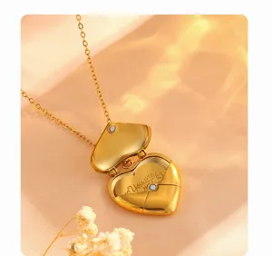 Detail view of gold heart envelope locket necklace, elegant titanium steel design.