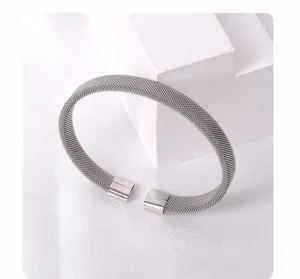 Stainless steel mesh cuff bracelet, geometric open design, chic everyday jewelry style for women.