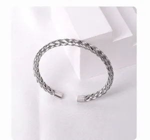 Silver titanium steel woven open cuff bracelet, exquisite minimalist fashion jewelry detail.