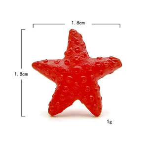 Detailaufnahme einer kleinen roten Seestern-Figur für DIY-Landschaftsbau, ca. 1.8cm und 1g.