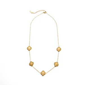 Detailed view of gold stainless steel five-leaf clover pendant necklace, fine jewelry detail.