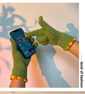 Green knit touch screen gloves for women, cute winter warm wool gloves with colorful ball trim.