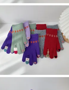 Cute winter knitted touch screen gloves for women with warm fleece lining and sweet cartoon patterns.