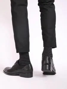 Detail shot of men's striped business socks, comfortable fit, perfect for formal wear.