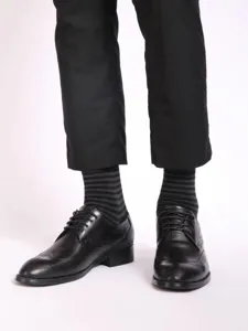 Detailed view of men's striped business socks in classic black and grey colorway.