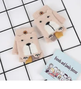 Detailed close-up of cute winter knit half-finger gloves with adorable bear face design.