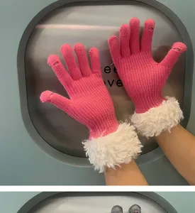 Close-up detail of women winter pink knit touchscreen gloves with plush white fur cuff style.