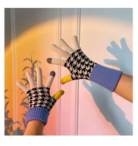Knitted touchscreen gloves with classic houndstooth pattern and colorful contrast fingers.