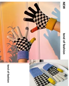Women touchscreen winter warm knit gloves featuring checkered houndstooth cute style.