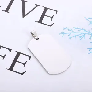 Stainless steel dog tag pendant close-up, blank metal surface for custom engraving.