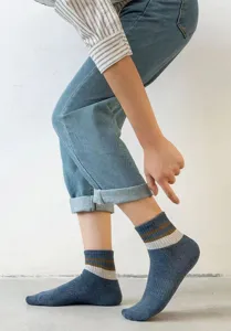 Detail view of men's cotton mid-tube socks with stylish double stripes for daily wear.