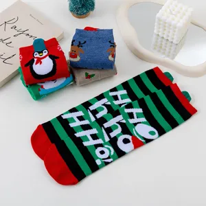 Cute Christmas cotton socks featuring penguin, reindeer and striped designs for winter season.