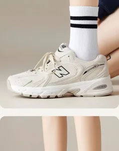 Stylish striped mid-tube cotton socks paired with retro casual sports sneakers for daily wear.