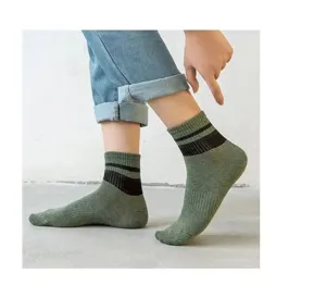 Detail view of men's green crew socks featuring classic black double stripes, soft breathable cotton.