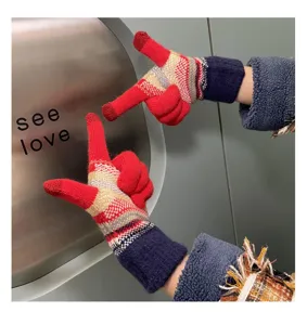 Close-up view of cozy fleece-lined knit gloves with colorful stripes and touch screen design.