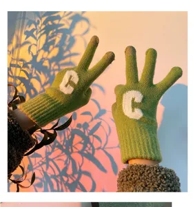 Cozy thick knit winter gloves detail for women featuring green wool and cute letter style.