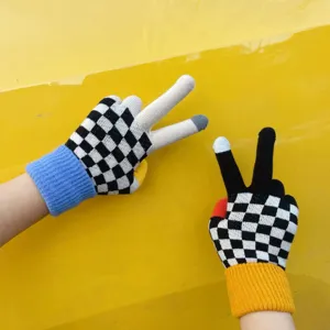 Knit touchscreen gloves featuring a stylish black and white checkerboard pattern and bright cuffs.