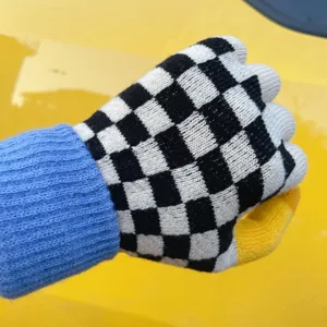 Winter warm knitted split-finger gloves with black and white checkerboard pattern, cozy.