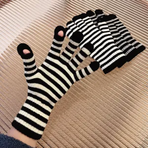 Black and white striped knitted fingerless gloves for winter warm touch screen outdoor use.