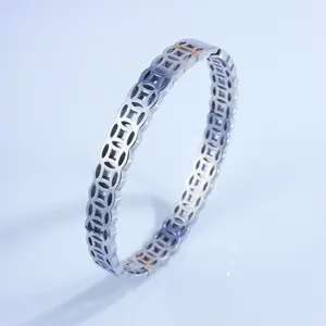 Detailed close-up of retro copper coin stainless steel ring, lucky fortune couple jewelry design.