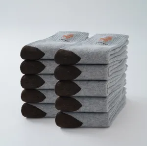 Close-up detail of thickened grey thermal loop socks with brown toes and embroidered sheep logo.