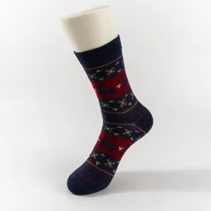 Close-up detail of Christmas knitted mid-tube sock featuring retro elk and snowflake pattern.