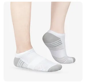 Detail shot of breathable low-cut athletic ankle socks with moisture-wicking striped design.